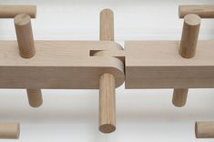 two wooden pegs are connected to each other