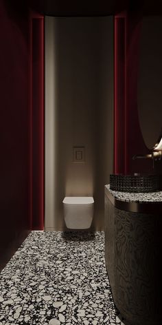 a white toilet sitting in a bathroom next to a sink and red curtained walls