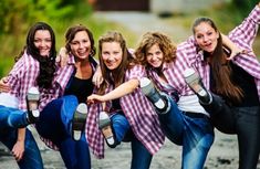 a group of young women standing next to each other