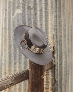 Western Fedora "Desperado"Inspired by the wild American Desert, and handmade with the highest quality materials, Untamed Hats embraces the free and undomesticated lifestyle of the west. Each piece representing a story and worn only by those with a brave and unbroken spirit. Welcome to our tribe. -Handmade -Designed and embellished in CA-Vegan suede is made in Mexico -Premium vegan suede-Premium vegan/faux snake skin-Luxury Rustic details -Black color -Large brim -Crown 4”-Pinched crown -Interior Distressed Western Fedora Hat, Artisan Flat Brim Fedora For Western-themed Events, Gray Western Fedora Hat, Western-themed Wide Brim Rigid Fedora, Western-themed Fedora Straw Hat, American Desert, Sale Promotion, Snake Skin, Luxury Items