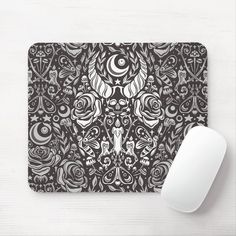 a mouse pad with a black and white pattern on it