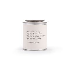 a white candle with a quote on it that says, may you be happy today