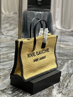 Description S.L Rive Gauche Tote Bag In Raffia For Women 18.9in/48cm YSL 685742GAAAG2099 Rep 1:1 Size: 48 x 36 x 16cm / 18.9 x 14.2 x 6.3 inches (Length x Height x Width ) Snap button Handle: double Big compartment Magnetic snap closure Include dust bag. This product is of the best quality. Designer Rectangular Straw Bag With Braided Handles, Designer Travel Straw Bag With Handles, Designer Woven Straw Bag For Travel, Designer Woven Straw Travel Bag, Luxury Rectangular Straw Bag With Handles, Designer Rectangular Straw Bag In Natural Color, Designer Rectangular Natural Straw Bag, Designer Natural Straw Bag For Travel, Luxury Rectangular Straw Bags