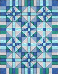 a blue and white quilt with triangles on the front, in shades of green and grey