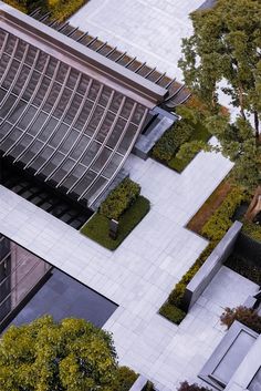 an aerial view of a building and trees