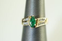 7 x 3.75mm marquis Emerald in great color. 12 Diamonds in an off set shoulder design. A really elegant ring showing light wear. 1.66 dwt Marquise Emerald Ring For Formal Occasions, Emerald Diamond Ring, Diamond Engagement Rings Vintage, Baroque Pearl Necklace, Amber Ring, Jade Ring, Ring Photos, Elegant Ring, Shoulder Design