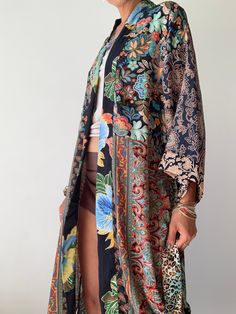 "This is colourful boho style floor length wrap tie robe with pockets made free size to fit most ladies, made of different silky material with colourful prints very light and comfy perfect daily home gown or street style cover up when layered over a tshirt and jeans length 55\" more avaialable at https://www.etsy.com/shop/AltheaStores? Thank You for looking" Long Printed Kimono For Beach Cover-up, Bohemian Long Sleeve Kimono With Vibrant Print, One Size Multicolor Boho Print Kimono, Bohemian Long Kimono With Vibrant Print, Silk Long Kimono For Beach Cover-up, Long Patterned Floral Print Kimono, Long Bohemian Kimono With Vibrant Print, Bohemian Patterned Kimono With Vibrant Print, Long Patterned Kimono With Floral Print