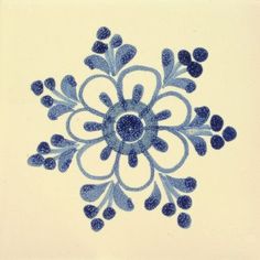 a blue and white snowflake is shown in the middle of a tile design