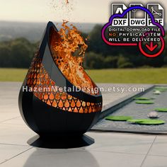 an outdoor fire pit with flames coming out of it and the words dxdwgp above it