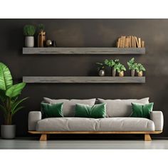 a living room with two floating shelves and green pillows on the couch in front of it