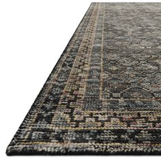 a large rug with an intricate design on the bottom and sides, in various colors