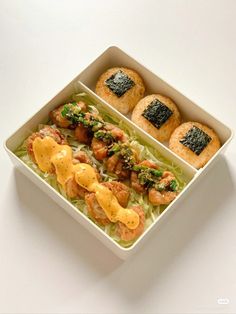 a white box filled with food on top of a table