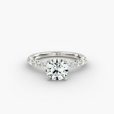 a white gold engagement ring with diamonds on the side