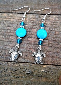 "Sea Turtle Earrings Beach Earrings Blue Jasper Turtle Earrings Sea Turtle Charm Jewelry Nautical Earrings Ocean Sea Life Earrings Handmade Earrings These cute Summer Fun \"Blue Jasper Turtle Earrings\" are a sure to please for the season.  The Tibetan Silver Sea Turtle Charms are adorable, light weight and easy to wear!  If you love the ocean and like wearing Nautical jewelry these earrings are for you.  A must have for all of you Sea Turtle Lovers out there *They are made 10 mm Natural Blue Ja Blue Dangle Earrings With Ocean-inspired Style, Ocean-inspired Blue Dangle Earrings, Blue Ear Wire Earrings For The Beach, Ocean-inspired Blue Earrings With Ear Wire, Blue Dangle Earrings For The Beach, Blue Earrings For Vacation, Handmade Adjustable Ocean-inspired Earrings, Ocean-inspired Adjustable Drop Earrings, Dangle Earrings For The Beach