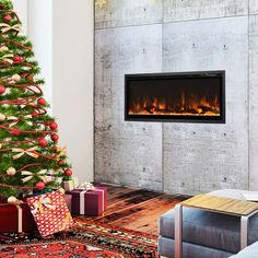 a living room with a christmas tree and fire place in the fireplace, surrounded by presents