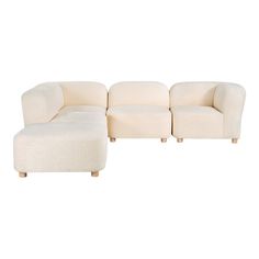 a white couch and footstool sitting next to each other on a white background