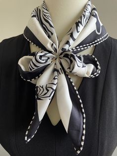 This 100% silk twill luxury square scarf with hand-rolled edges has black white galloping zebra pattern.  Beautiful Zebras galloping in a group. Their vivid black stripes are highlighted in detail. Material: 100 % mulberry silk twill This scarf is made of 6A grade 14 momme 100% mulberry silk which is heavier, softer, and more durable. Silk twill is one of the finest silk fabrics, woven with a pattern of diagonal parallel ribs for reinforced structure. Perfect gift for Valentine's Day and Mother's Day gifts. Size: 70 cm x 70 cm / 27 in x 27 in As this scarf is hand-rolled, the dimensions indicated may vary. Edges: Hand-Rolled  This essential accessory complements any outfit. Can style as a neck scarf, a head scarf, or at the waist. Suitable for all seasons, gift ideas for the holiday season Elegant White Rectangular Scarves, Trendy White Silk Scarf For Formal Occasions, Elegant White Square Silk Scarf, Elegant White Square Scarf, Black Square Silk Scarf Gift, Elegant Black Square Silk Scarf, Elegant Black Rectangular Silk Scarf, Black Rectangular Silk Scarf, Trendy Black Silk Square Scarf