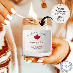 a woman is holding a jar with a candle in it and the label says, your custom names and date