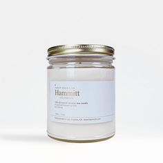 a white jar with a label on it