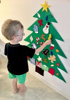 "Play Kiddo Christmas Tree!  Let your little one celebrate the season with their own Christmas tree! Made of top quality wool blend and 100% wool felt. Each tree comes with an assortment of 22+ ornaments including stockings that are customizable with your child's initials. ( Choose up to 2 initialed stockings with each additional stocking just a dollar each and will be in a separate post ). Fun for play year after year!  These trees also make GREAT gifts for those who can't make it home for the holidays and/or don't have the space for a big tree. They are perfect to send to a love one who may be deployed this holiday or a college student for their dorm! If you want to use the tree as decoration and would like them glued permanently to the tree please tell me in your notes!  Dimensions - H- Diy Kids Christmas Tree, Diy Felt Christmas, Toddler Christmas Tree, Trees For Kids, Diy Felt Christmas Tree, Christmas Trees For Kids, New Years Tree, Felt Tree, Christmas Tree Set