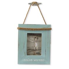 a blue frame hanging on a rope with the words make waves