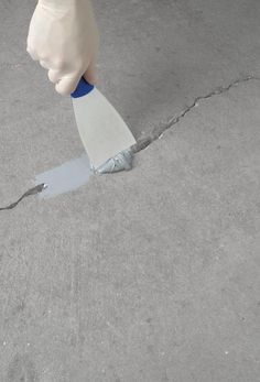 Concrete Patch and Repair is a 2-part epoxy that creates a surface stronger than concrete. For use on all indoor/outdoor concrete. Industrial strength formula will not crack or shrink. Easy to apply and repairs cracks up to 14 linear feet at 1/2 inch thick. Can be painted in 8 hours with no priming required. Low odor compound permanently bonds concrete. Rust-Oleum Concrete Patch and Repair 24-oz Gray Concrete Patch | 301012 Malaysia Building, Fix Cracked Concrete, Repair Concrete Driveway, Concrete Filler, Repair Cracked Concrete, Concrete Repair Products, Cracked Concrete, Driveway Repair, Concrete Patio Makeover