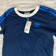 Brand New , With Attached Tags. Size Small Style : 3 Stripes Tee I’m 4’10. Navy Cotton Tops With Three Stripes Branding, Navy Cotton Striped Tops, Casual Navy Tops With Three Stripes Branding, Blue Three Stripes Tops For Summer, Blue Cotton Tops With Three Stripes, Adidas Blue Three Stripes Top, Adidas Blue Tops With Three Stripes, Blue Adidas Tops With Three Stripes, Adidas Blue Tops With Three Stripes Branding