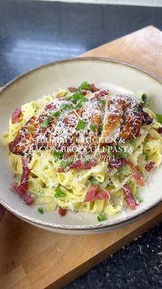 a white plate topped with pasta and meat