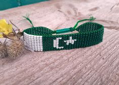 Loom beaded bracelet with Pakistan flag. Patriotic hand woven beaded wristband is a great gift for a man, women or child for birthday, Christmas, Valentine's Day and other holidays. Such bracelet with South Asia country symbol can be small frienship gift for best friend. Is suitable for daily wear. Bracelet in stock and ready to ship. More bracelets here: https://www.etsy.com/shop/BeadSeeShop?ref=seller-platform-mcnav&section_id=30144819 The bracelet is made of Czech seed beads and strong nylon Handmade Symbolic Beaded Bracelets As Gift, Symbolic Handmade Beaded Bracelets As Gift, Handmade Symbolic Beaded Bracelets For Friendship, Handmade Symbolic Friendship Bracelets As Gift, Symbolic Handmade Friendship Bracelets As Gift, White Bracelets For Independence Day Gift, Adjustable White Beaded Bracelets For Independence Day, Handmade Round Beads Jewelry For Independence Day, Handmade Jewelry With Round Beads For Independence Day