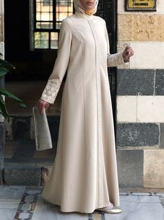 Lace Shirtdress Jilbab Elegant Spring Abaya With Modesty Panel, Elegant Cream Long Sleeve Abaya, Elegant Long Sleeve Cream Abaya, Elegant Abaya With Modesty Panel, Elegant Long Abaya With Button Closure, Elegant Spring Tunic Abaya, Elegant Tunic Dress With Buttons, Elegant Abaya Designs, Formal Abaya