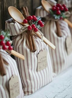 wooden spoons are wrapped in brown and white striped paper