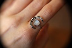 "Very bold large crescent moon moonstone ring! The genuine faceted moonstone measures 8mm and has such wonderful rainbow moonstone quality! This is an open design that has thick 14 gauge sterling silver connecting the 2 independent pieces for strength and durability. The moon has been formed to arch around the finger making this a nice sleek uniform design! Moon measures approx.: 3/4 inch from top to bottom Faceted Moonstone: 8mm 14 gauge band Solid 925 sterling silver ★ IMPORTANT SHIPPING & Crescent Moonstone Ring For Gift, Celestial Moon Shaped Moonstone Crystal Ring, Celestial Moon-shaped Moonstone Crystal Ring, Spiritual Crescent Moonstone Ring With Moon Phase, Spiritual Crescent Moonstone Ring, Moonstone Crystal Ring With Moon Phase, Bohemian Moonstone Crystal Ring In Moon Shape, Bohemian Moonstone Moon-shaped Crystal Ring, Bohemian Moonstone Ring With Moon Phase Detail