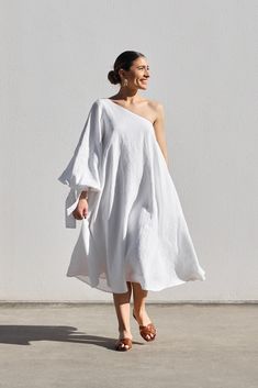 DESIGNED IN AUSTRALIA The One Shoulder Balloon Sleeve Swing Dress is a loose and full dress worn with a right sleeve. It has full balloon sleeves with a self tie. The dress has an invisible zipper closure at the side. The fit is designed to be comfortable and loose made in the IL signature white mid-weight linen, giving a beautiful natural texture which softens with wear. SHIPPING + RETURNS: Please allow 1-3 days for delivery within Australia (depending on location) Store Credit or Exchange only Linen Outer, Full Dress, White Balloons, Invisible Zipper, Wearing Dress, Swing Dress, Pretty In Pink, Pants Set, Balloons