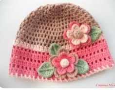 a crocheted hat with flowers on it