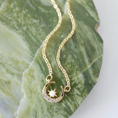 "Beautiful and lovely gold moon necklace made of tiny cubic and opal gold moon charm with skinny gold plated brass chain. The soft and warm-looking necklace is good for yourself or gift! Your necklace will ship in a rudiana gift box. ♥Length 14\" - 20\" ♥Moon charm 1/2\" x 1/2\" ♥Gold plated over brass / Cubic Zirocnia / Opal stone ♥ Delivery Time Fast shipping within 1 - 3 days ♥ See more Rudiana Accessories Rudiana.etsy.com" Gold Crescent Moon, Gold Moon Necklace, Celestial Necklace, Gold Cross Necklace, Gold Charm Necklace, Gold Moon, Moon Charm, Stone Gold, Opal Stone