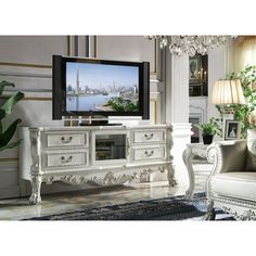 a living room filled with furniture and a flat screen tv