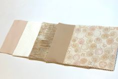 four different shades of fabric on top of each other