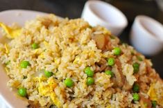 rice with peas and eggs on a plate