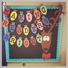 a bulletin board with the words making readers bright written on it, and a reindeer