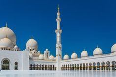 a large white building with many arches and domes