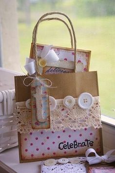 a bag sitting on top of a window sill with buttons and lace around it