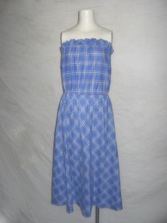 Vintage Avon Fashions Made In USA ILGWU label Blue White Stripe Plaid Strapless Ruffled Tube Top Sun Dress  Size 13/14  Length: 40" Width at Top: 14" Relaxed 20 1/2" Extended  Waist: 14 1/2" Relaxed 16 1/2" Extended  Hip: 24"  Bottom Opening: 36 1/2"  Material Cotton or Cotton Blend  Dress is good used pre-owned vintage condition Please contact me with any questions regarding this item Avon Fashion, Cotton Blends Dress, Size 13, Vintage Avon, Tube Top, Sundress, Dress Clothes For Women, White Stripe, Favorite Outfit