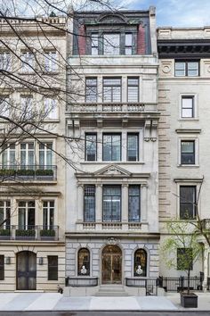 an apartment building with many windows and balconies on the second floor, in new york city