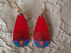 "Laurel Burch Earrings KIRIN PEACOCK Dangle French Ear Wires Red Teal Gold Vintage Jewelry 1980s These gorgeous Laurel Burch teardrop earrings are done in a bright red with accents of teal over shimmering polished brass; cool vintage finds from the 1980s. Each measure approx. 1.25\" X 3/4\" with 14k Gold Filled French Ear Wires with gold beads & coils. Named and signed on the back: KIRIN/Laurel Burch.  A Genuine LAUREL BURCH COLLECTIBLE from the mid-1980s. This hard to find pair is in lovely con Retro Teardrop Earrings As Gift, Retro Teardrop Earrings, Retro Red Dangle Earrings, Retro Teardrop Earrings For Pierced Ears, Red Enamel Pierced Earrings, Red Pierced Enamel Earrings, Vintage Red Teardrop Jewelry, Red Enamel Earrings, Red Retro Metal Jewelry