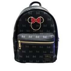 a black backpack with a red bow on it's head and mickey mouse ears