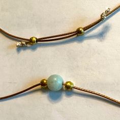 Light Green 8 Mm Amazonite Bead Brass Beads Are 4 Mm Golden Tan Waxed Nylon Cord Is 1 Mm Easily Adjustable Corded Beaded Necklace Has No Clasps And Simply Slips Over Your Head. Sliding The Brass Beads Away From Each Other Will Shorten The Necklace To Any Length That You Want. Gravity Does Eventually Lengthen The Necklace, But It Generally Takes A While. It’s Part Of The Wabi Sabi, The Perfectly Imperfect, Nature Of Hand Crafted Items In This @Pixielife Closet. Unique Jewelry Handmade By Pixie Li Gold Aventurine Beaded Jewelry, Adjustable Jade Jewelry For Meditation, Casual Gold Necklaces With Round Beads, Adjustable Brown Beaded Round Necklace, Adjustable Aventurine Jewelry With Natural Stones, Adjustable Brown Beaded Necklace, Adjustable Brown Round Beaded Necklace, Adjustable Round Brown Beaded Necklace, Earthy Adjustable Round Necklace