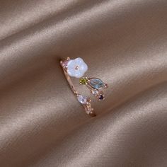 Bloom, blossom, and grow! Designed to capture the beauty of a blooming flower, this ring is a must-have. Spring Wedding Rose Gold Jewelry, Spring Rose Gold Flower Jewelry, Rose Gold Jewelry For Anniversary In Spring, Rose Gold Jewelry For Spring Anniversary, Rose Gold Ring For Spring, Spring Rose Gold Ring Jewelry, Rose Gold Flower Ring For Promise, Rose Gold Flower Promise Ring, Flower Shaped Wedding Rings For Spring