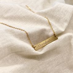 Manifest your dreams. Made with 14K gold or Sterling silver Gold filled 4/20 or sterling silver bar & chain Engraved design 18 in. chain 2 in. extender chain Care Instructions: Light surface cleaning with an untreated cloth or mild soapy water. Limit use in water and exposure to chemicals. Gold Bar Necklace Engraved, Latina Jewelry, Lingot D'or, Engraved Bar Necklace, Manifest Your Dreams, Engraved Design, Gold Bar Necklace, Silver Bar, Silver Bars