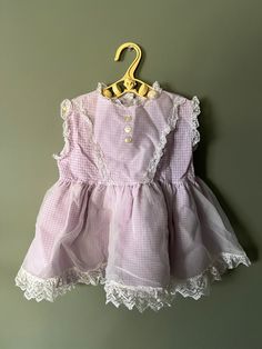 This is the cutest litttle purple and white gingham dress with a sheer overlay! Dress is sheer with a sweet lace trim and in very good condition for its age. i would say fits a 12-18 months in my opinion. but please follow measurements for proper fit. would more than likely need bloomers as it's more like a swing dress length P2P doubled 24" 14.5" length Purple Gingham Dress, Lace Trim Dress, Gingham Dress, Swing Dress, Lace Trim, Gingham, Dress Length, Violet, Girls Dresses