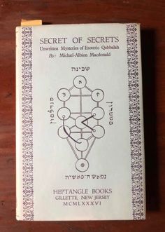 the secret of secrets book on a wooden table